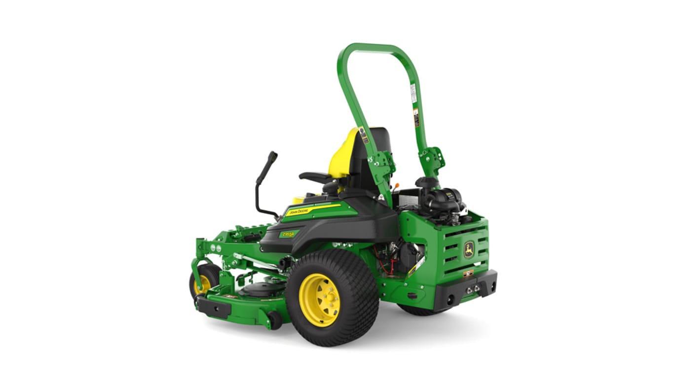 Rear-left view of a green and yellow riding mower with roll bar, large rear wheels, and various controls