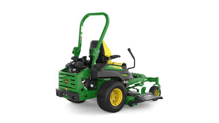 Rear-right view of a green and yellow riding mower with roll bar, large rear wheels, and various controls