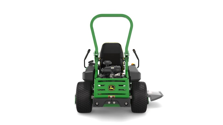 Rear view of a green and yellow riding mower with roll bar, large rear wheels, and various control