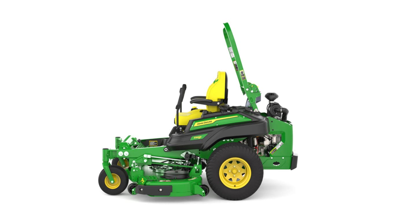 Left-side view of a green riding lawn mower with a yellow seat, black wheels, and various controls.