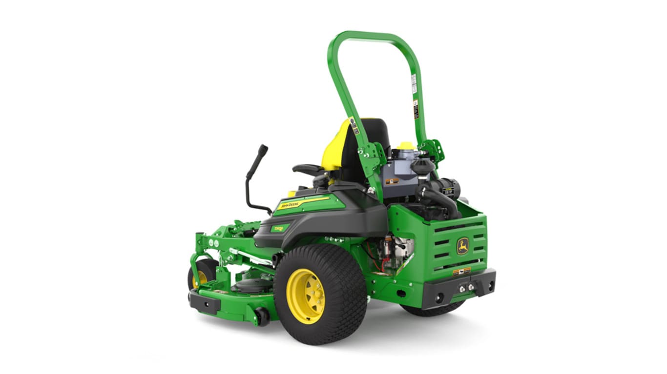 Rear-left view of a green riding lawn mower with a yellow seat, black wheels, and various controls.
