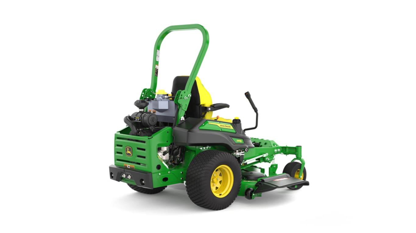 Rear-right view of a green riding lawn mower with a yellow seat, black wheels, and various controls.