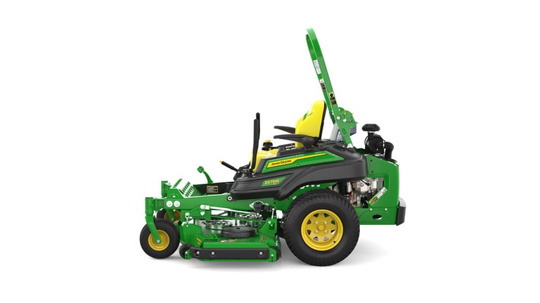 Left-side view of a green riding lawn mower with a yellow seat, black wheels, and various controls.