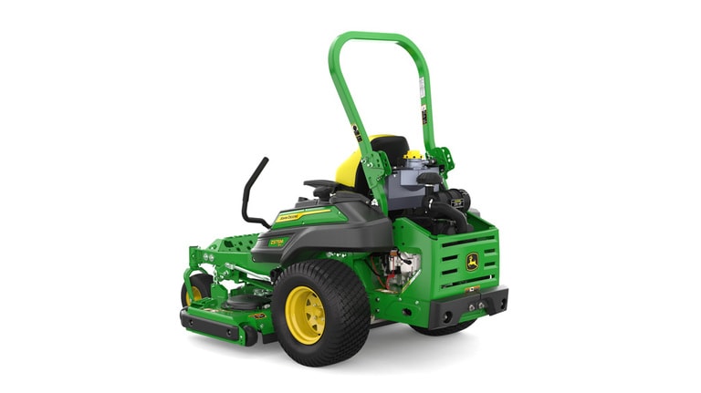Rear-left view of a green riding lawn mower with a yellow seat, black wheels, and various controls.