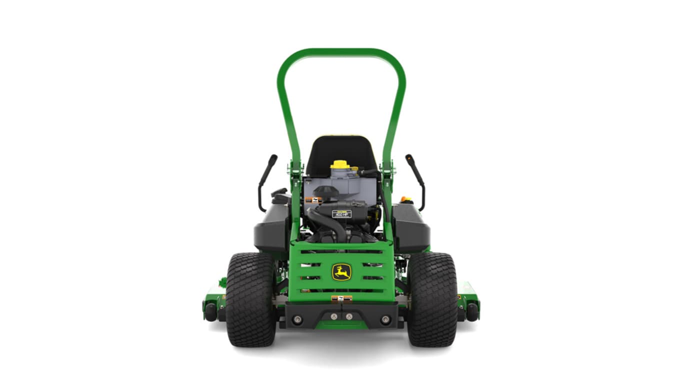 Rear view of a green and yellow riding mower with roll bar, large rear wheels, and various controls