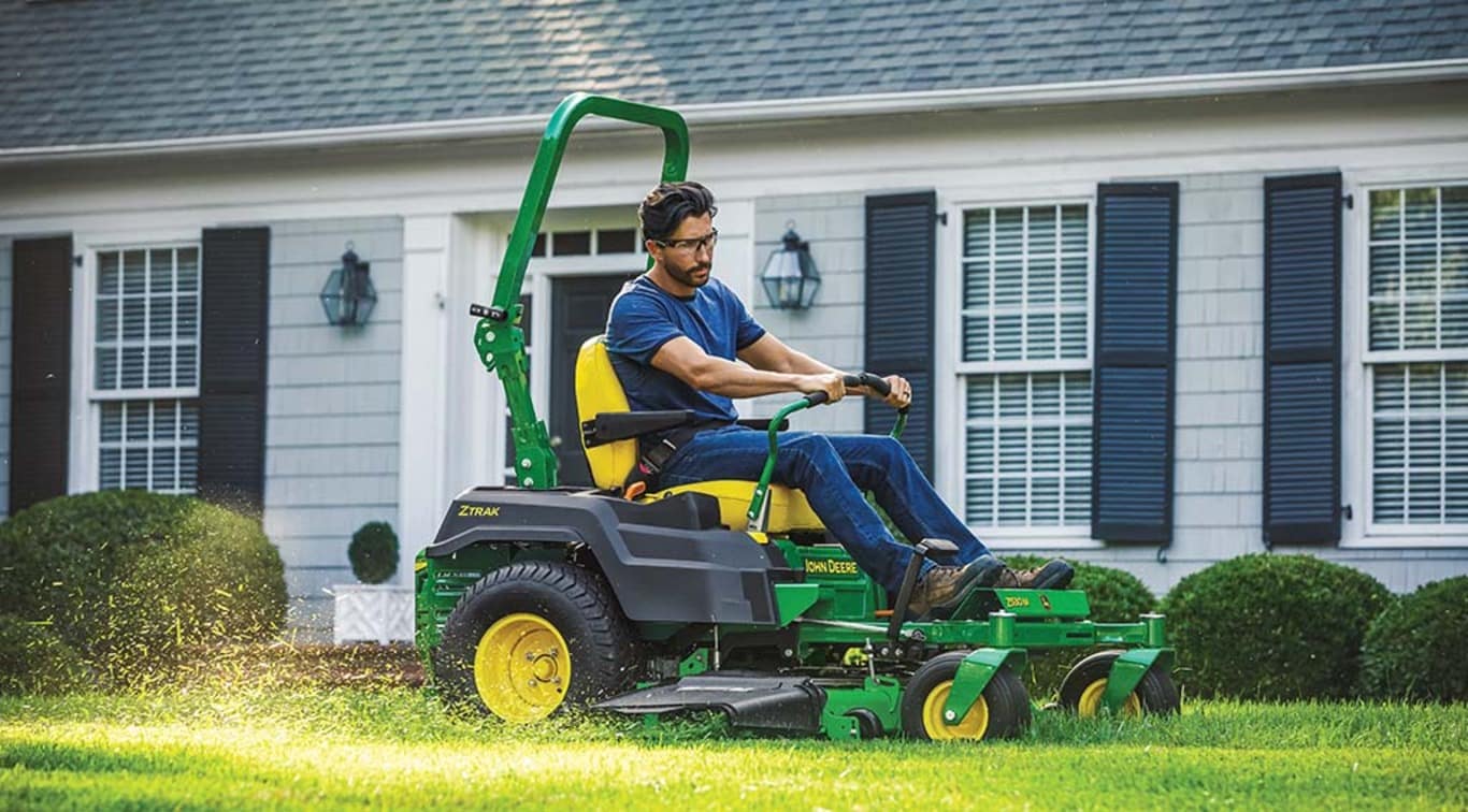 a person mowing his lawn in an Z530M Mower