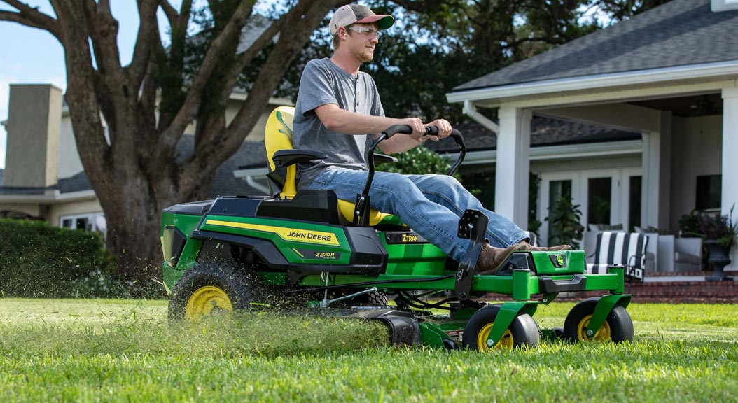 Person mowing grass on Z370R Zero-turn mower