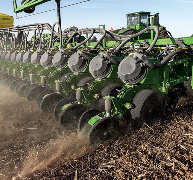 9RX 640 Tractor pulling DB90 54Row20Planter with ExactEmerge&trade; in a field