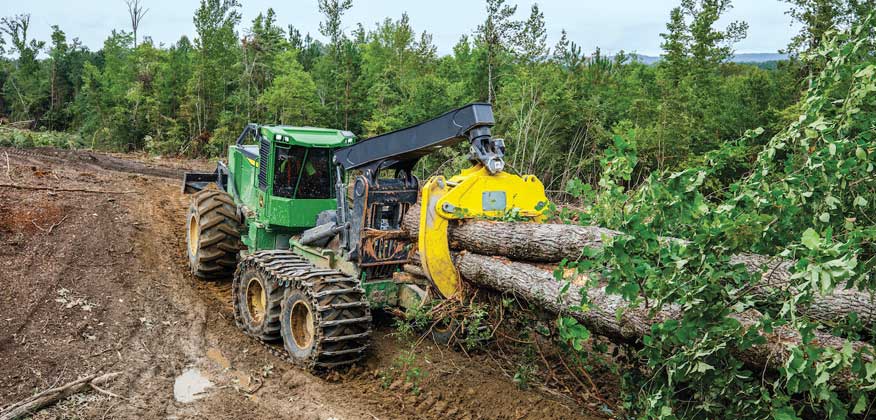 768L-II Bogie skidder hauls felled trees