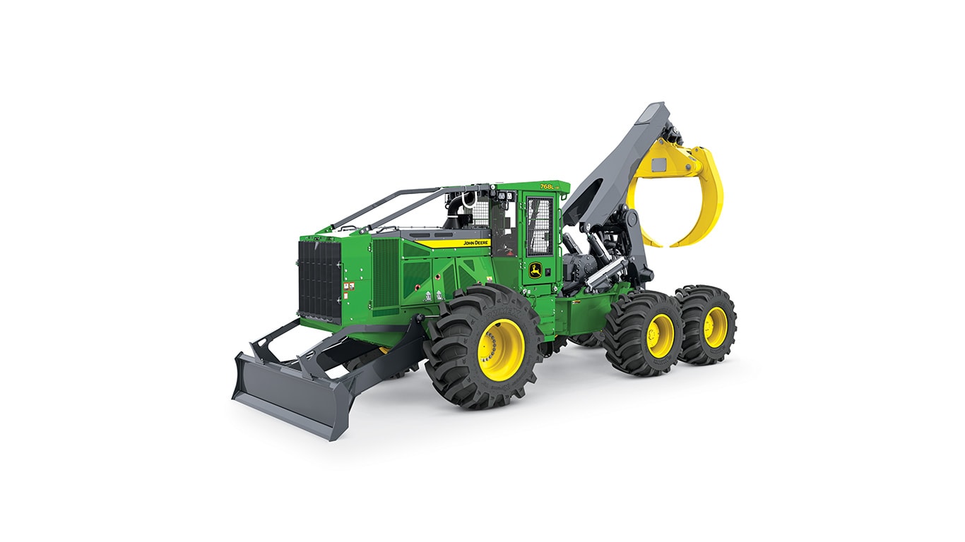 Machine forestière verte et jaune avec de gros pneus et une lame niveleuse à l’avant pour les travaux d’abattage.
