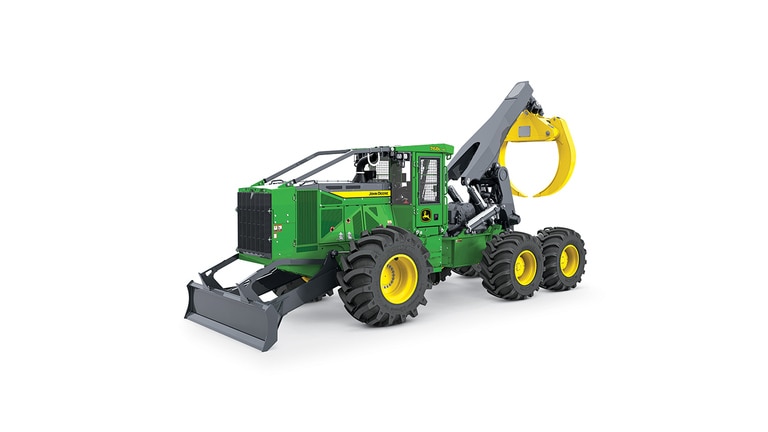 Machine forestière verte et jaune avec de gros pneus et une lame niveleuse à l’avant pour les travaux d’abattage.