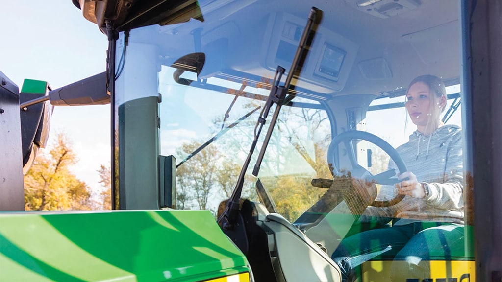 Essuie-glace du tracteur 9RX 830 avec conducteur dans la cabine 