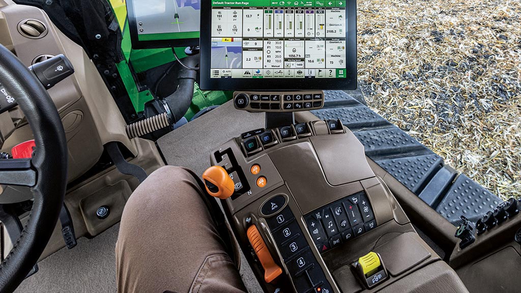 Image de l’intérieur de la cabine d’un tracteur 9RX dans un champ