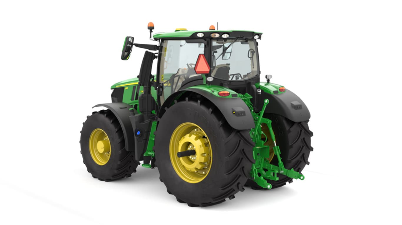 Studio image of the rear left side view of a green 6R 230 Utility Tractor.