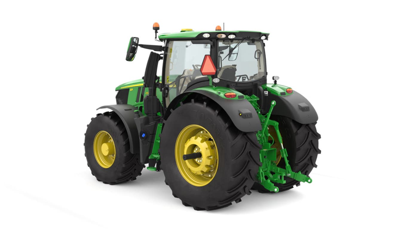 Studio image of the rear left side view of a green 6R 250 Utility Tractor.