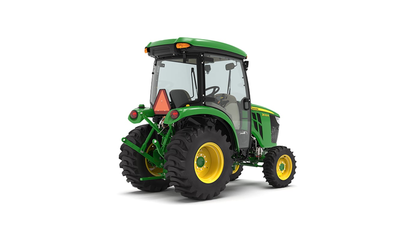 Tracteur compact 3033R vu de l'arrière droit sur fond blanc