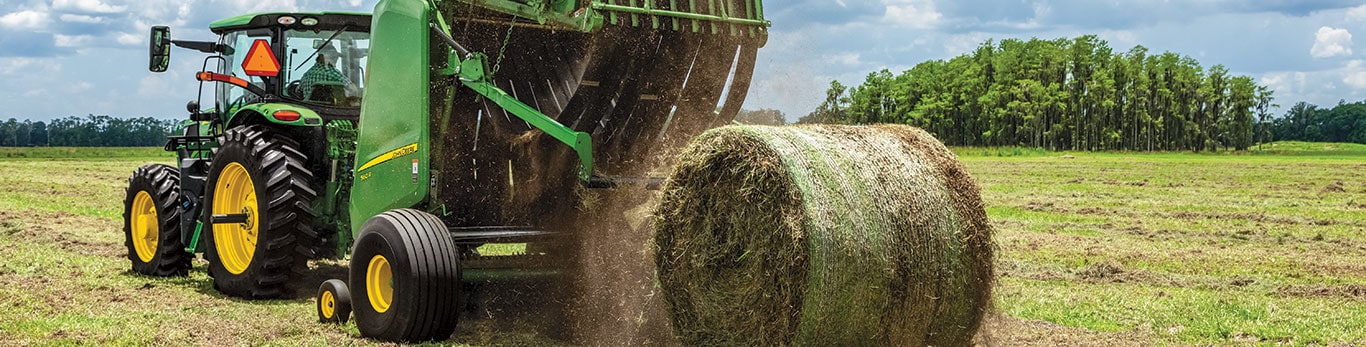 John Deere 6R Tractor baling hay