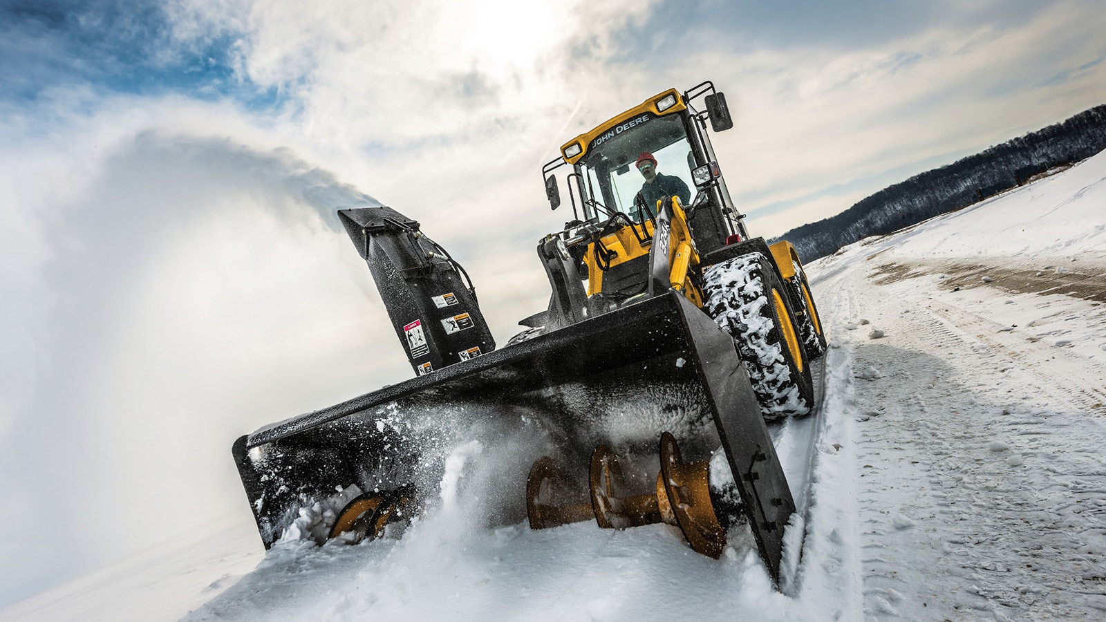 Compact wheel loader with snow blower attachment