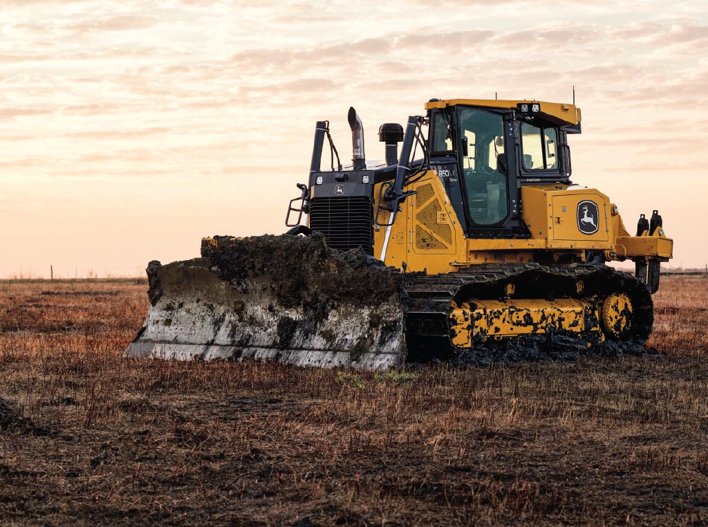 The 850 X-Tier SmartGrade Dozer is shut down on the jobsite as the sun sets.