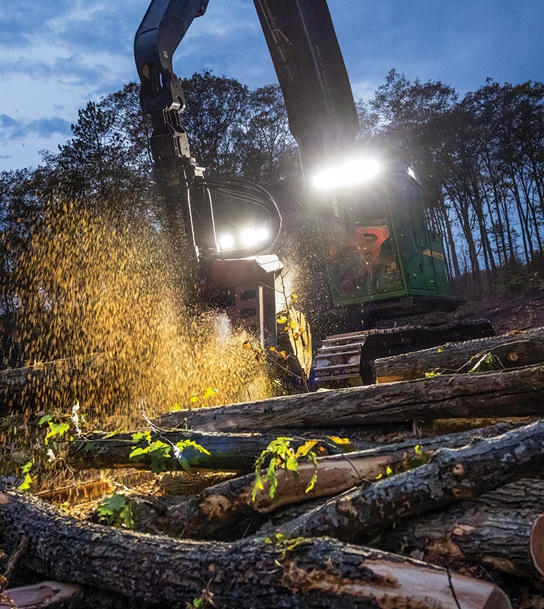 John Deere 853MH Tracked Harvester with a Waratah HTH 623C head to process logs at the landing site