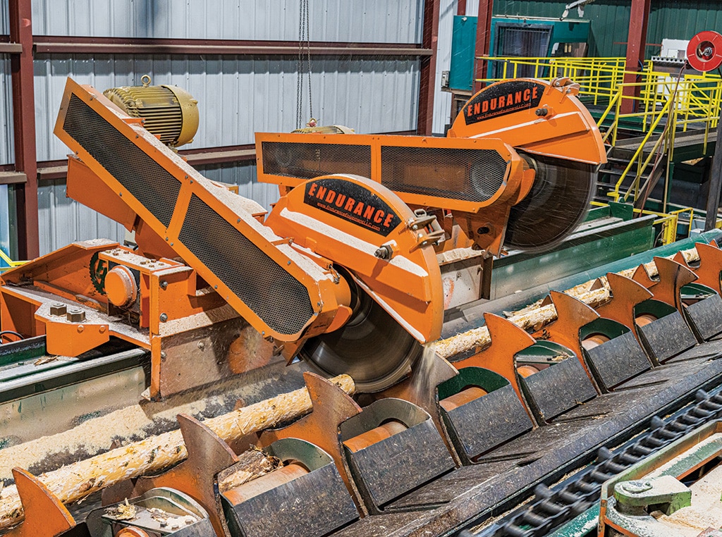 The vertical carriage saws are cutting the logs into stems.