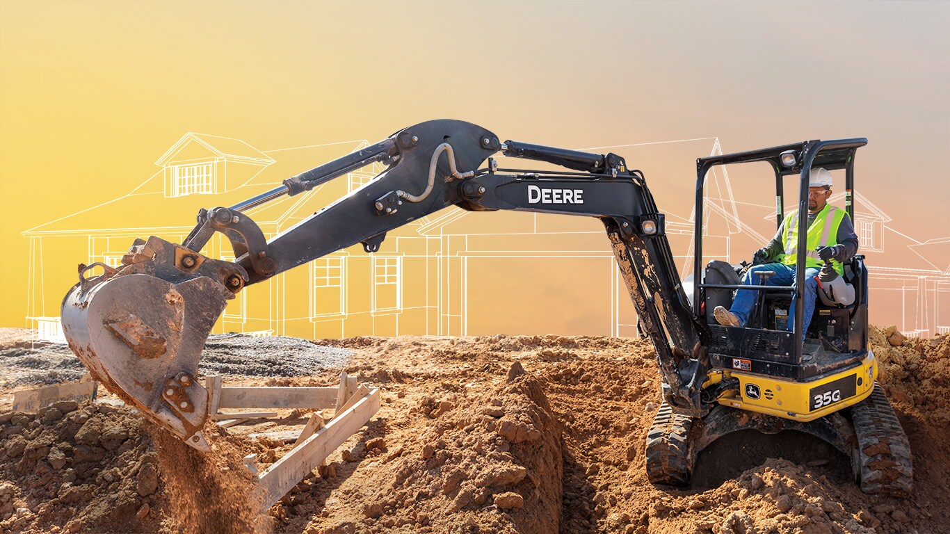 : A John Deere 35G Compact Excavator is creating the trench to lay pipes for a new home at a housing development.