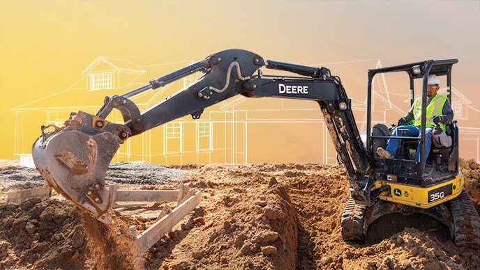 A John Deere 35G Compact Excavator is creating the trench to lay pipes for a new home at a housing development.