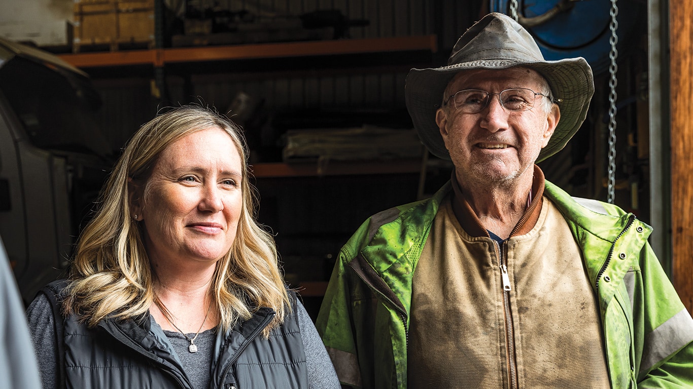 Hayley Ferguson and her father Tim Messer standing in their machine shed.