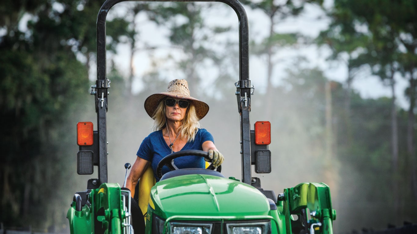 Woman driving tractor