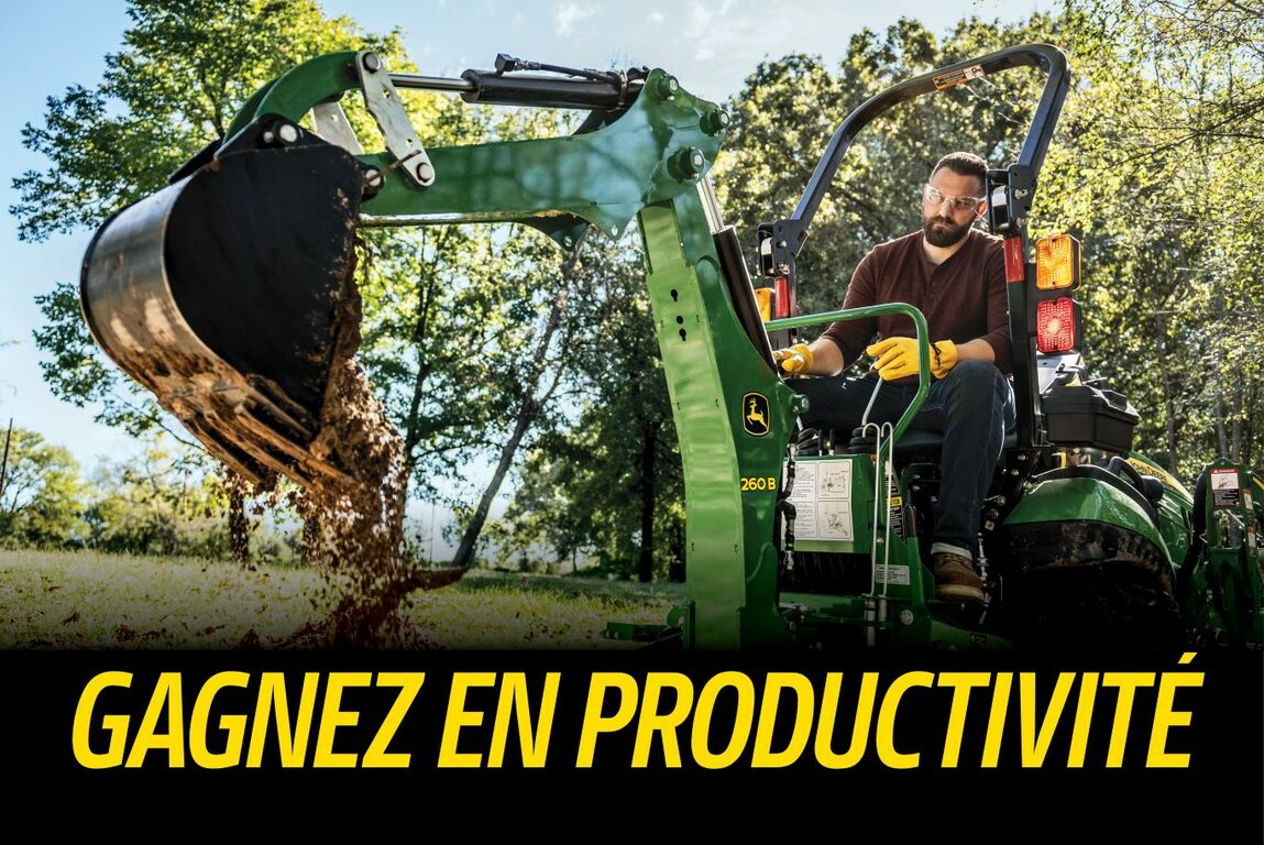 Homme utilisant l'équipement de pelle-rétro 260B avec l'expression devenir productif