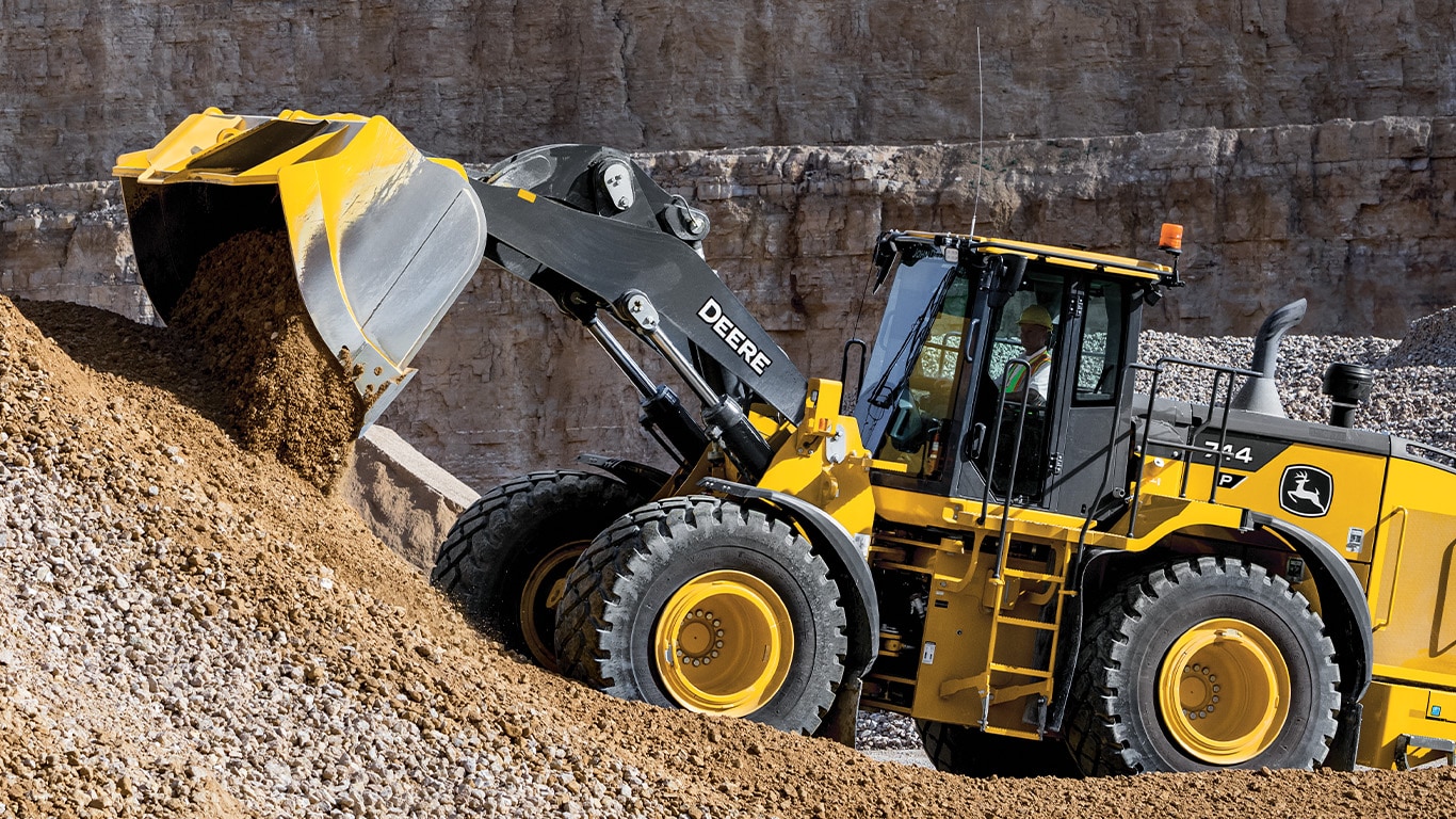 Large photo of the 744 P-tier wheel loader dumping dirt on the job site