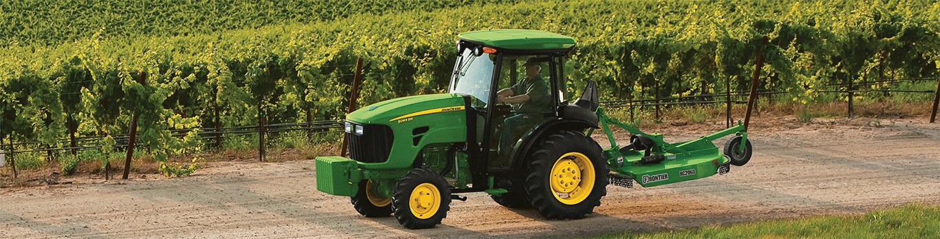 tractor with implements in a crop