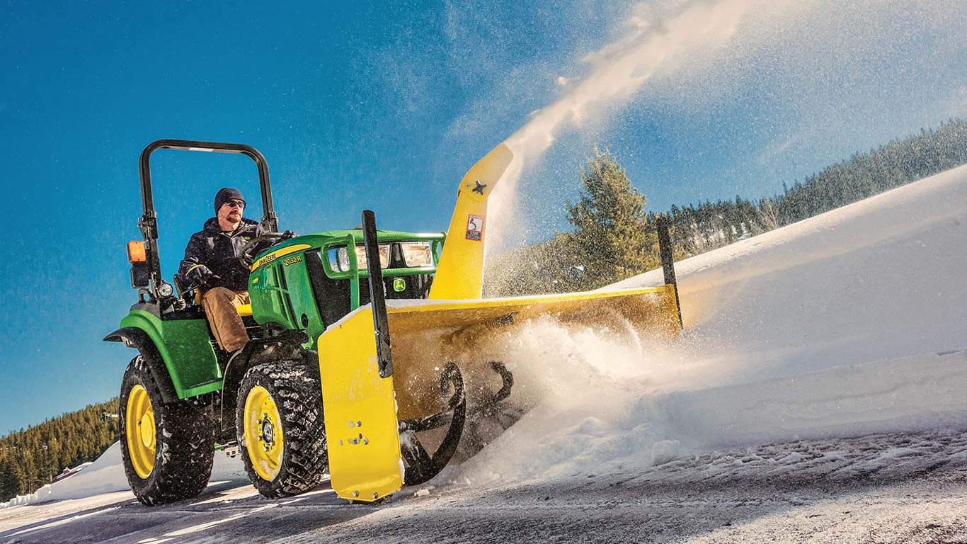 2r family tractor using snowblower attachment to remove snow
