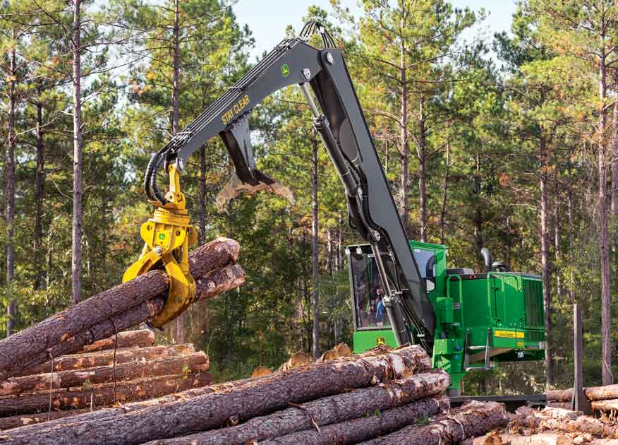 John Deere forestry equipment being operated picking up some logs