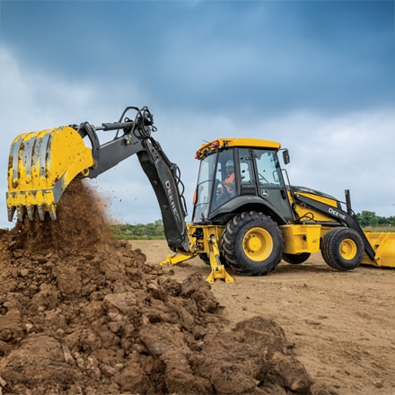 310 X-Tier Excavator digging in dirt pile