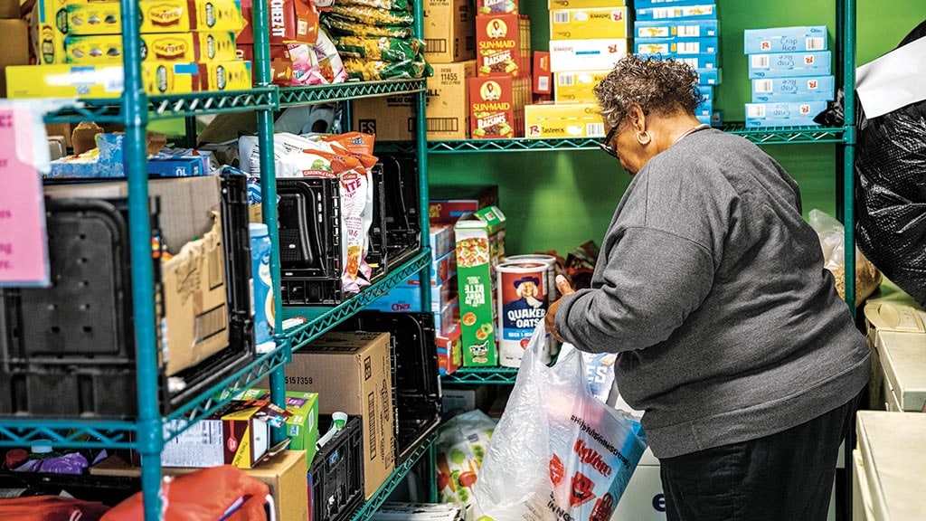 employee helping at a food bank