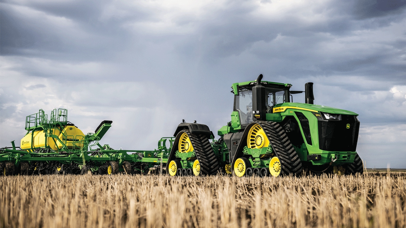 New 9RX 830 tractor pulling a P680 Precision Air Hoe Drill with the new C850T air cart through the field.