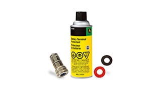 Battery terminal protector spray can with a metal connector and two colored washers.
