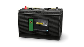 John Deere StrongBox battery with labeled front panel and top terminals.