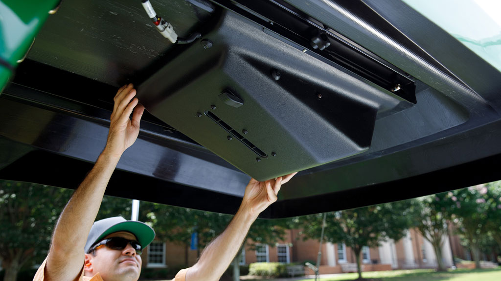 man installing canopy