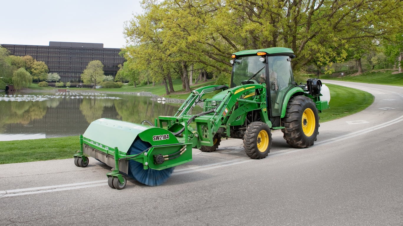 Tractor with broom on street