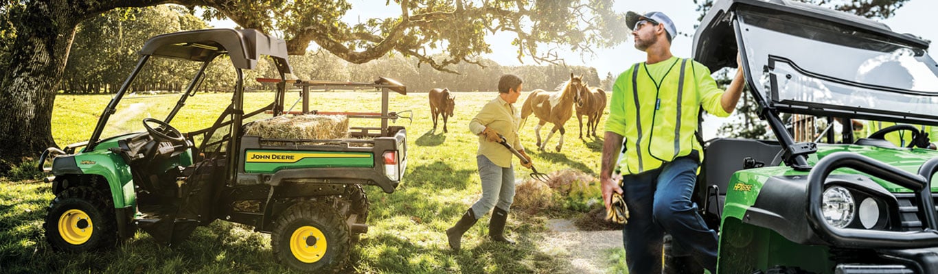 People doing work with HPX615E Gator Utility Vehicle