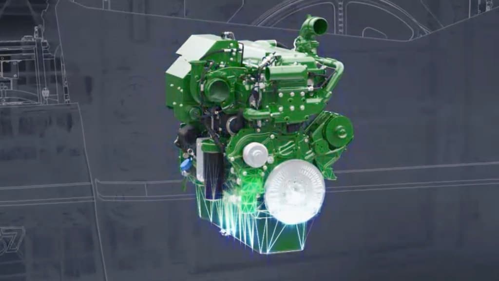 Photo of an uninstalled John Deere PowerTech™ 13.6L engine against a blueprint-like background