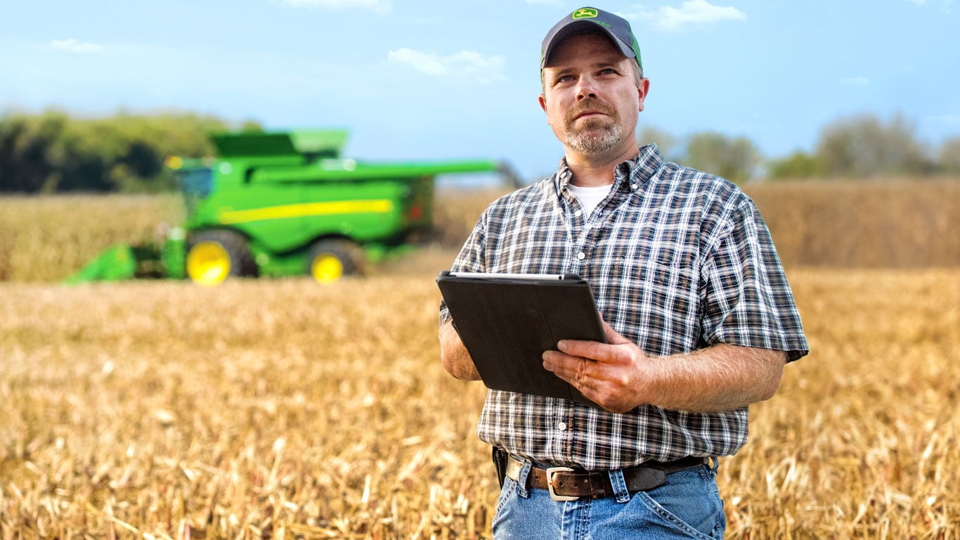 Photo of person in field with mobile device