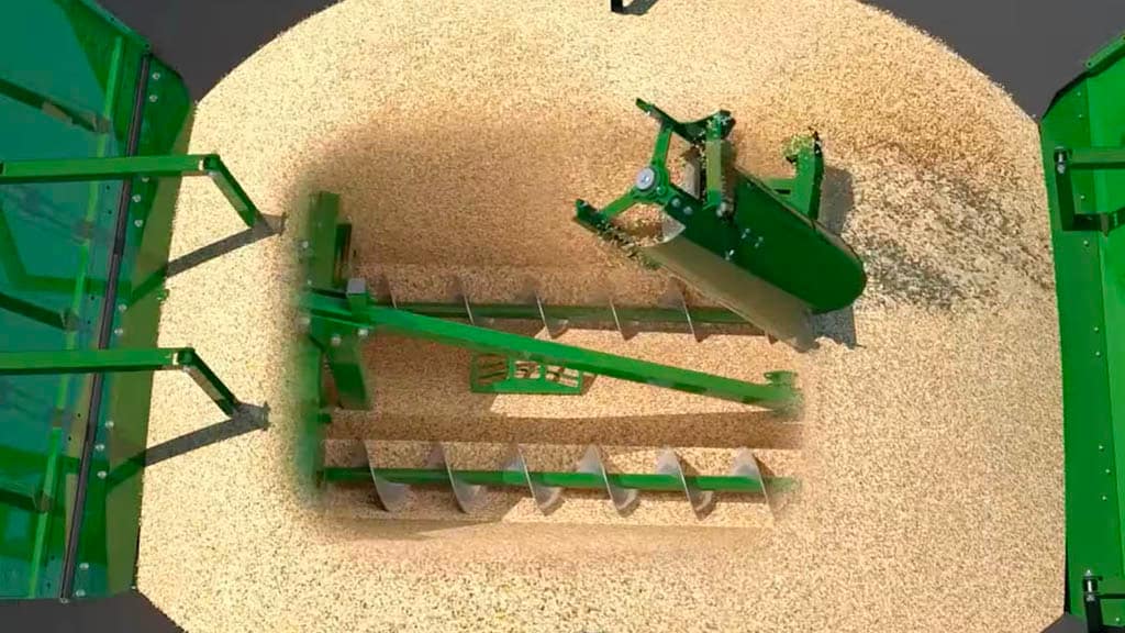 Photo en plongée du système d’arrêt de vis sans fin transversale dans la trémie à grain d’une moissonneuse-batteuse S7 John Deere.