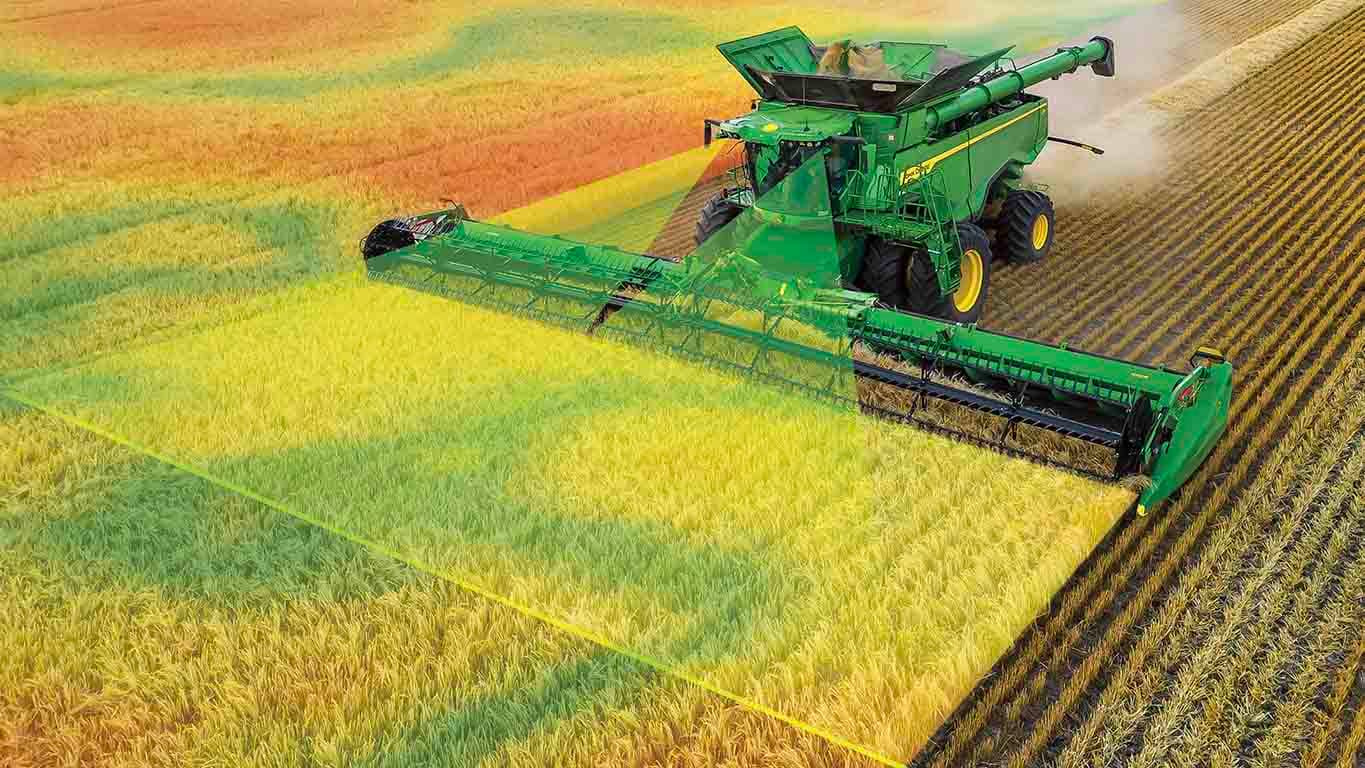 Photo d’une moissonneuse-batteuse X9 récoltant du blé avec une tête de draper. Les graphiques simulent des caméras frontales scannant les cultures, ce qui est livré avec l’automatisation prédictive de la vitesse au sol