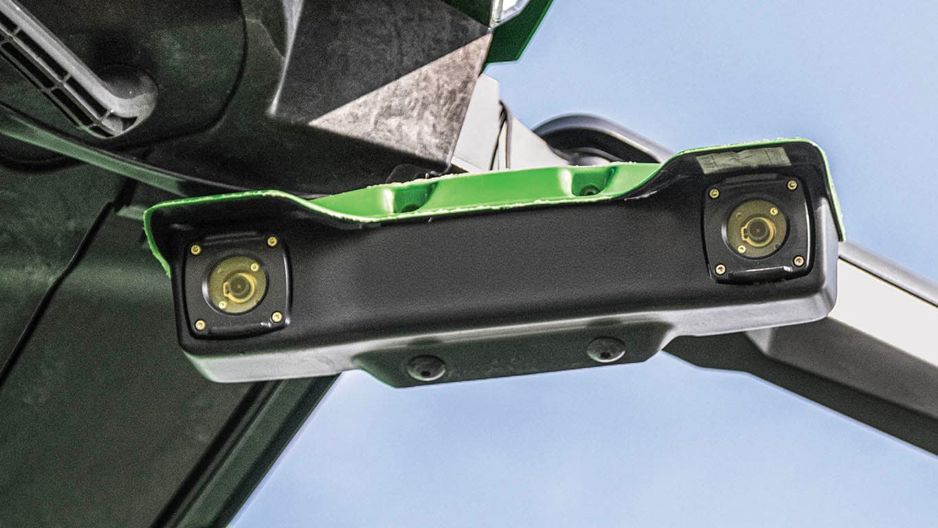 Photo of the front-mounted stereo cameras that measure crop height and volume as part of the Predictive Ground Speed Automation technology available on John Deere X9 Combines