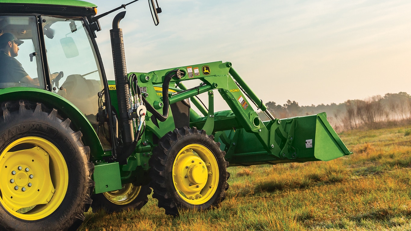 H240 Loader shown on tractor