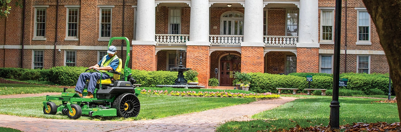 Person cutting grass on Z760R Zero Turn Mower on commercial property