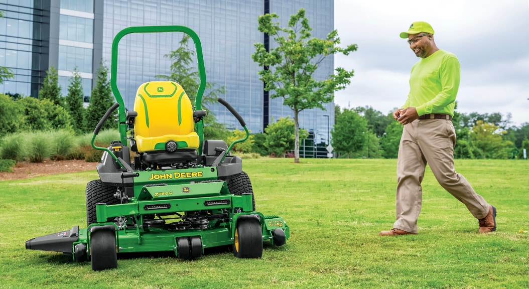 Person walking up to Z760R Zero Turn Mower